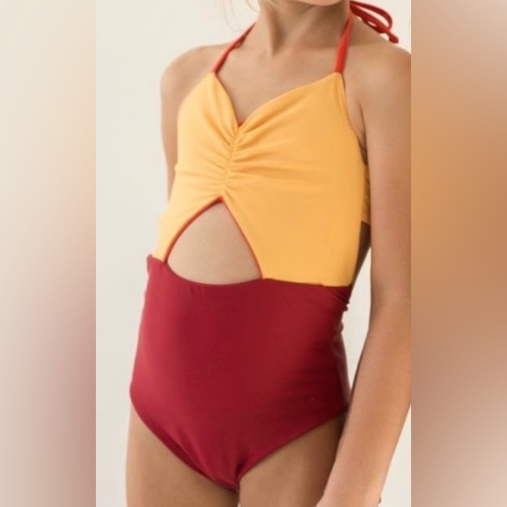 Girl’s Reversible Swimsuit,Colors gold, burgundy, & orange. Girl size 6